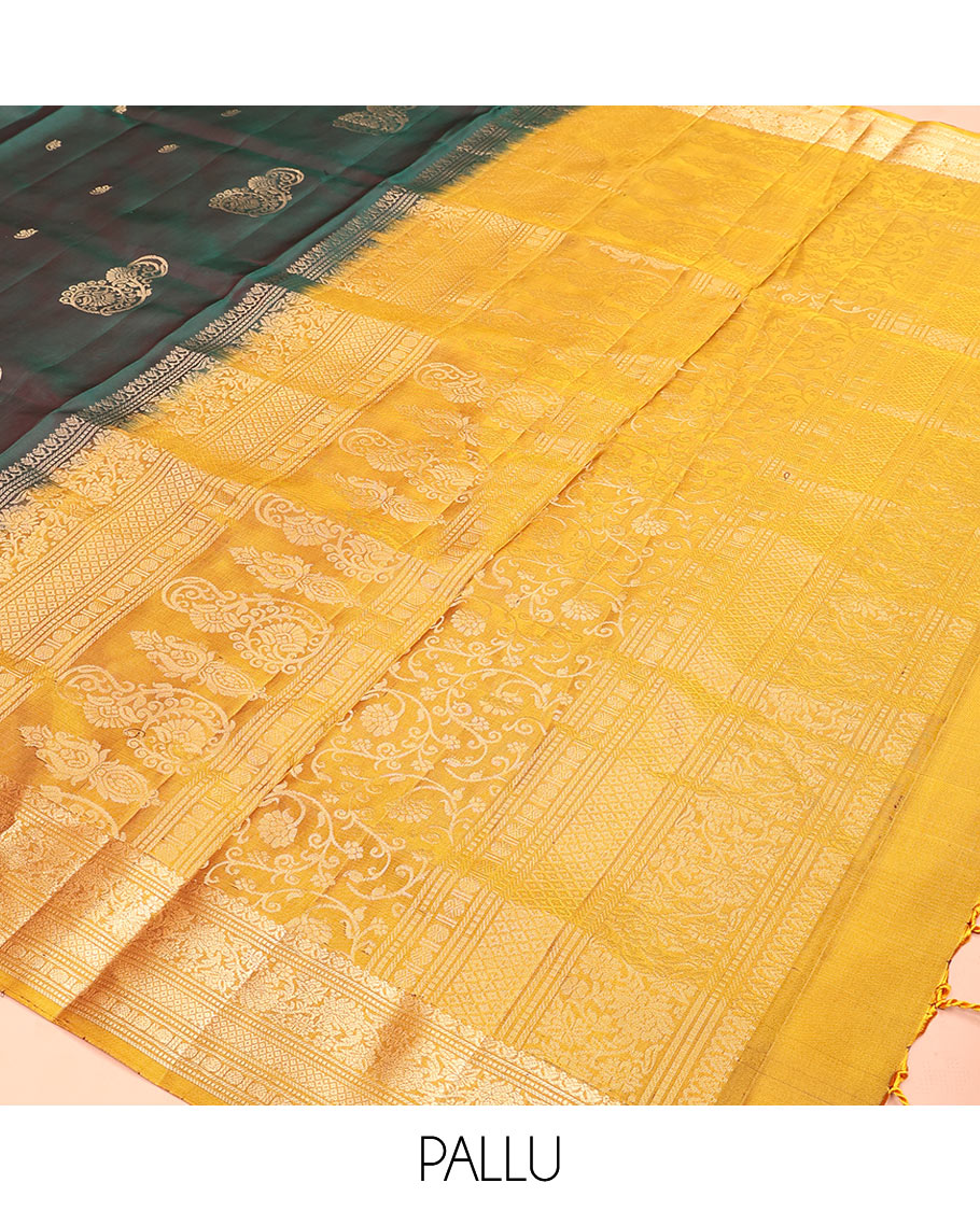 Green zari buttas soft silk saree, contrast border of salngai, muthu, banaras, kodi visiry, rudraksham, and mayil kann, and floral vine pallu