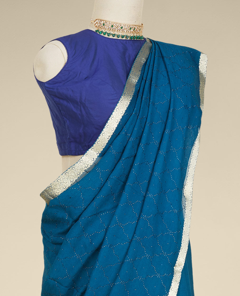 Blue embroidered pure chiffon saree with jaal patterned in micro stones, intricate border & pallu