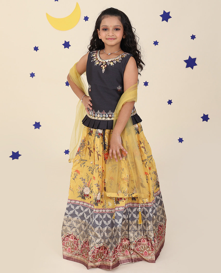 Yellow cholly set features a floral printed skirt, contrast embroidered puff-sleeve blouse & net dupatta