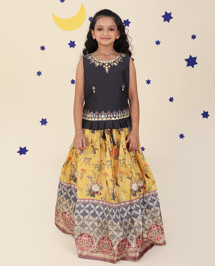 Yellow cholly set features a floral printed skirt, contrast embroidered puff-sleeve blouse & net dupatta