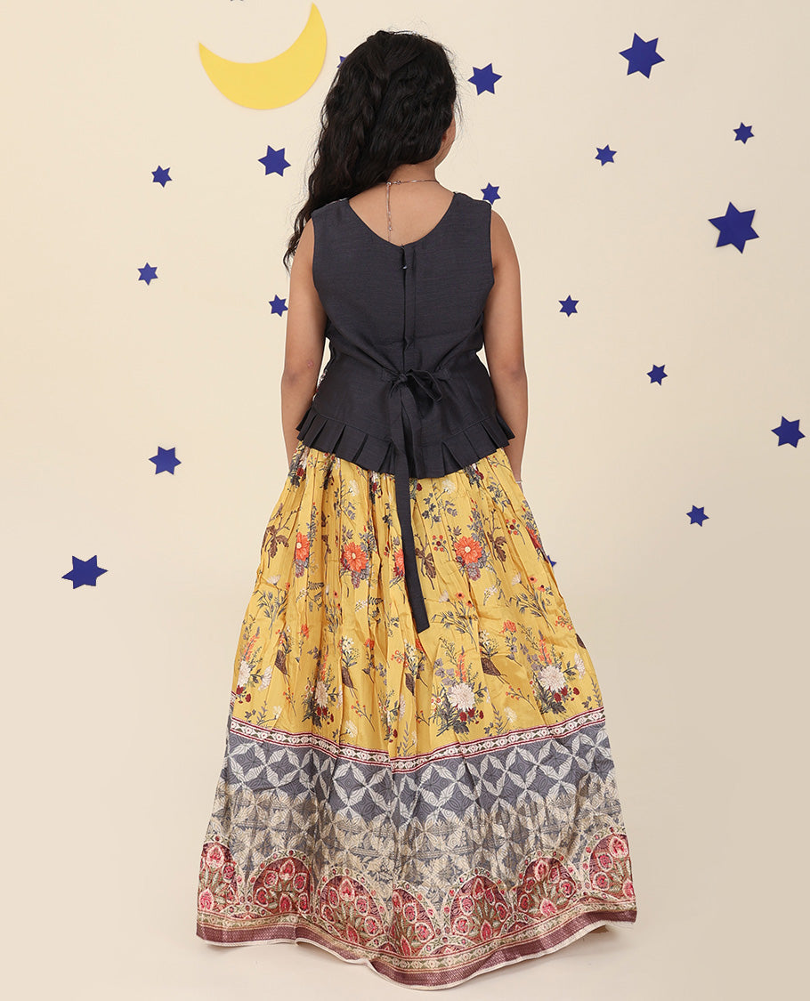Yellow cholly set features a floral printed skirt, contrast embroidered puff-sleeve blouse & net dupatta