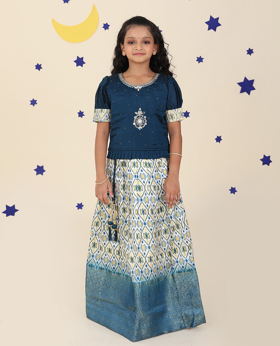 Cream cholly set features ogee printed & traditional border skirt, contrast embroidered puff-sleeve blouse & net dupatta