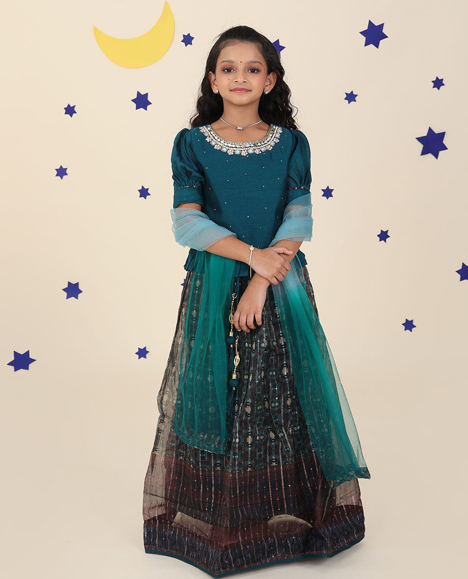 Blue cholly set features intricately printed skirt, embroidered puff-sleeve blouse & net dupatta