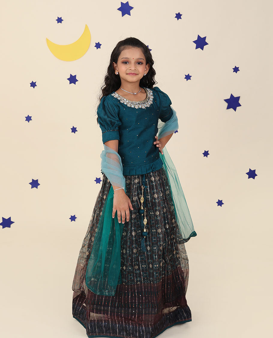 Blue cholly set features intricately printed skirt, embroidered puff-sleeve blouse & net dupatta