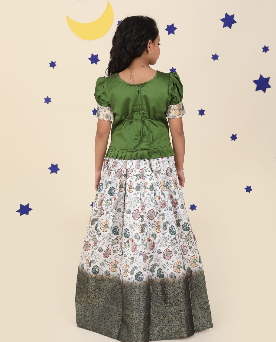 White cholly set features floral vine printed & traditional border skirt, embroidered puff-sleeve blouse & net dupatta