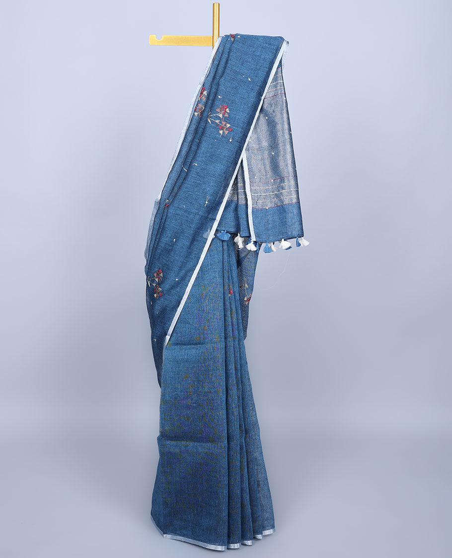 Borderless blue thread embroidered linen saree features floral motifs, pallu of sequin stripes