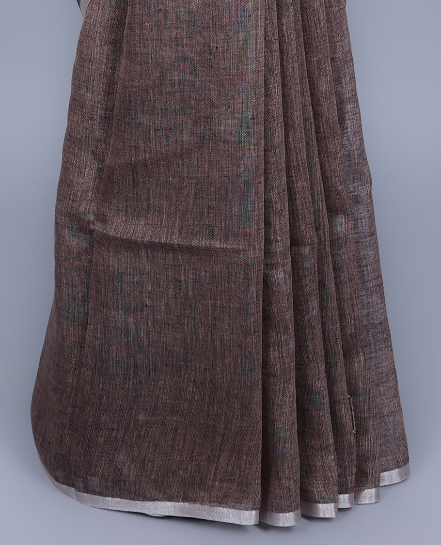 Borderless brown embroidered linen saree features geometric designs, self-pallu of stripes with tassels