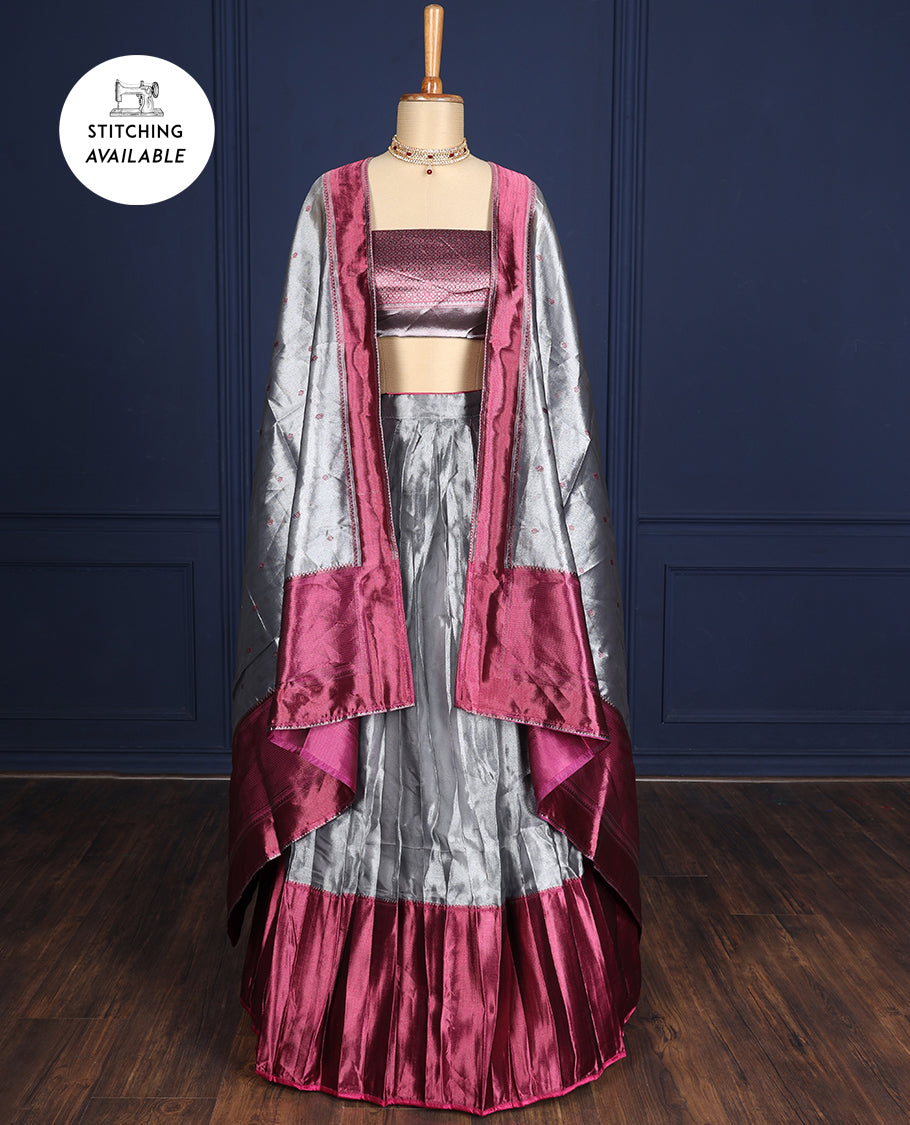 Silver grey tissue half-saree, contrast traditional motifs border, jacquard blouse & dhavani of intricate designs