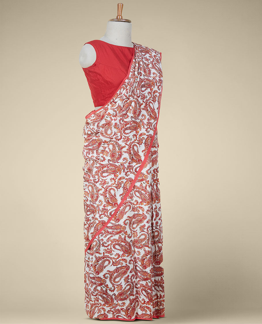 Borderless cream intricate paisley motifs printed fancy crepe saree