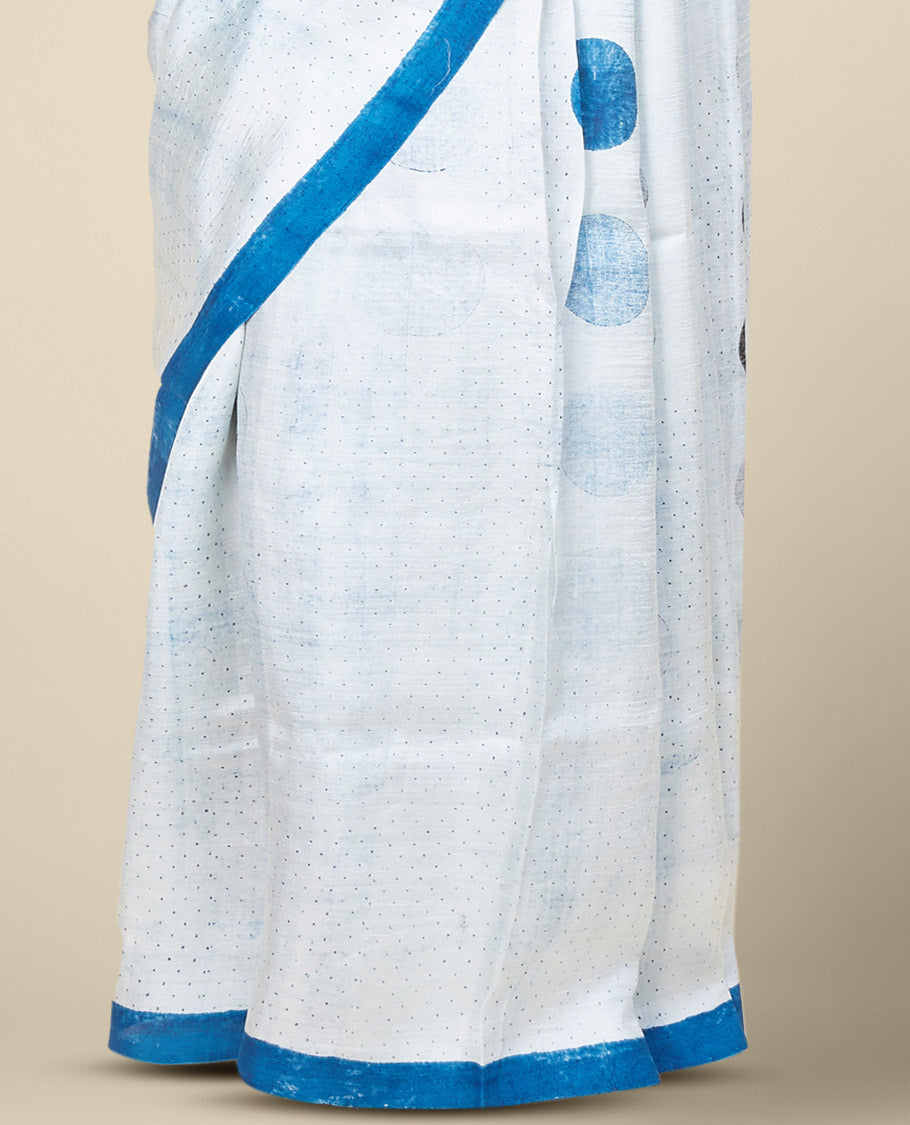 Blue printed silk saree stepped with polka dots, a plain border