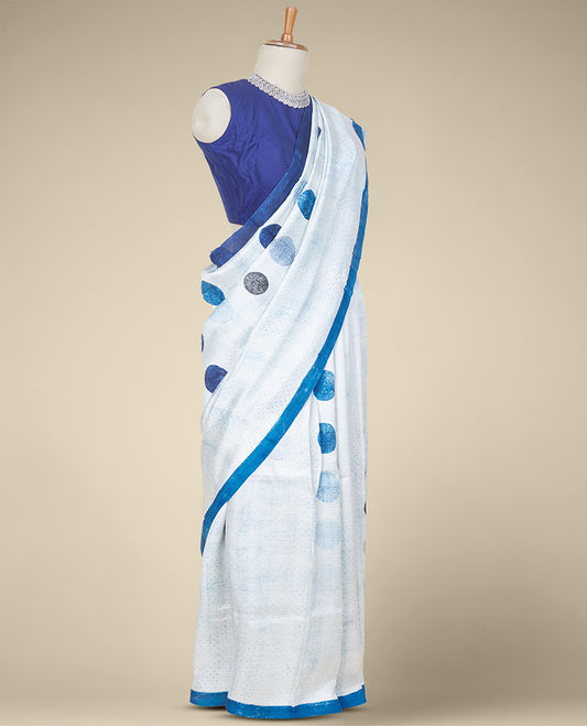 Blue printed silk saree stepped with polka dots, a plain border