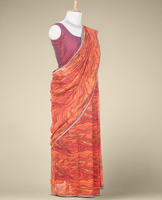 Borderless orange abstract-style printed pure chiffon saree