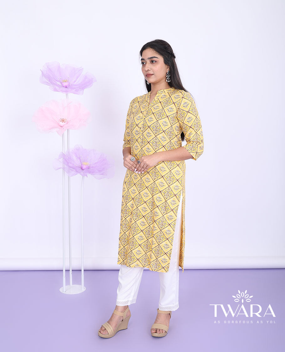 Twara yellow intricately printed Chinese collar with 3/4th sleeve rayon straight-cut below-knee kurti
