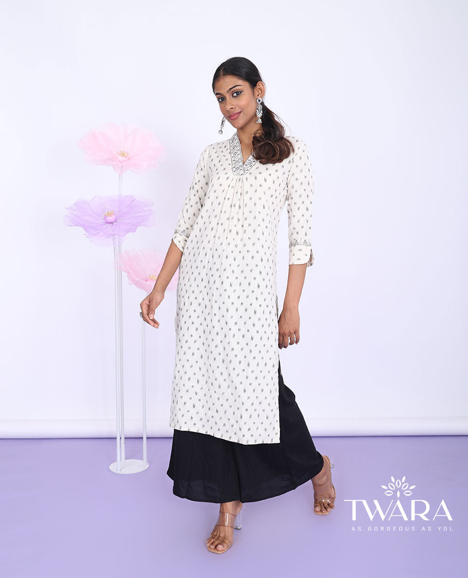 Twara cream unique motifs & embroidered v-neck with 3/4th sleeve cotton straight-cut below-knee kurti