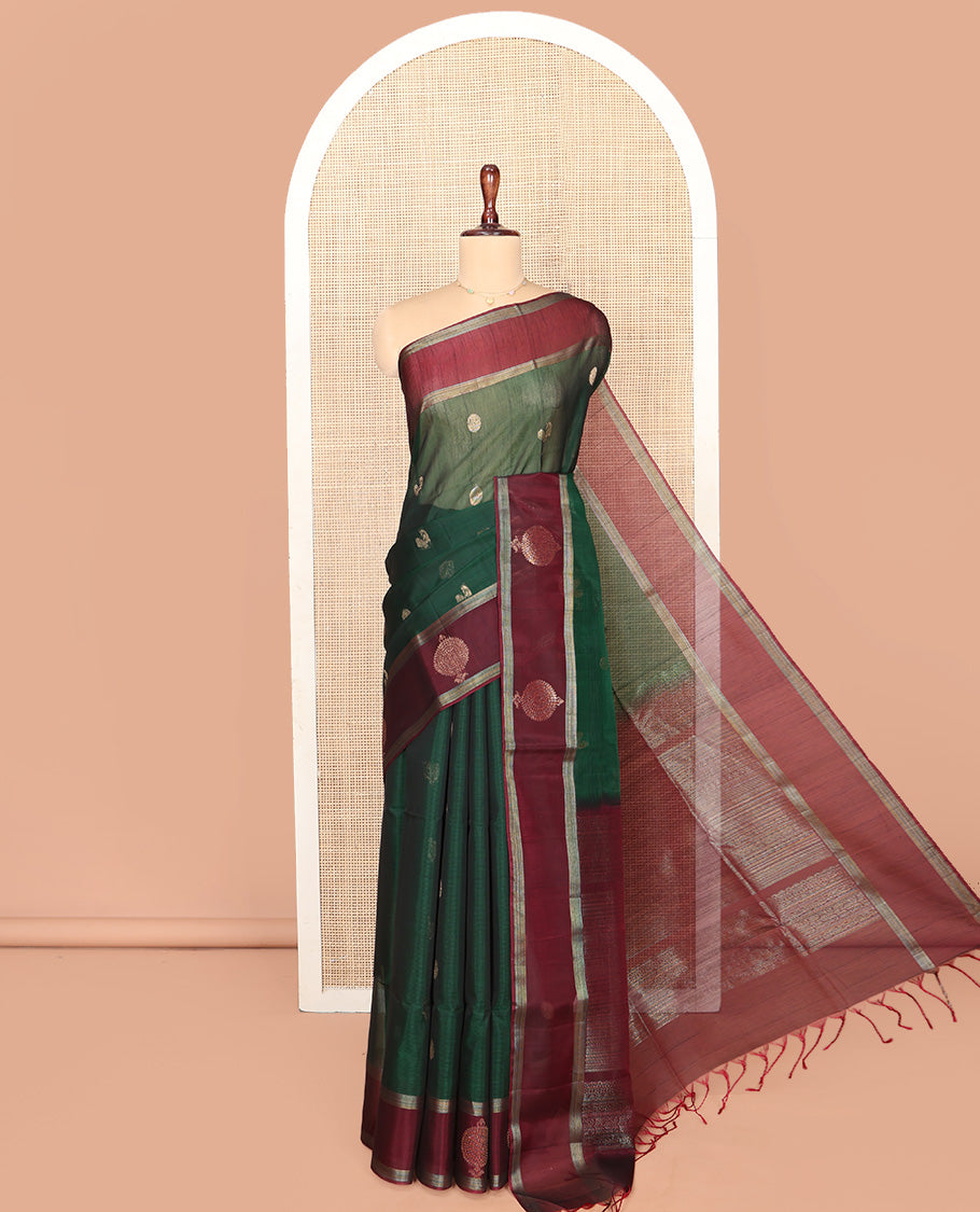 Green Silk Cotton Saree, Artfully Woven with Peacock and Rudraksham Motifs On Its Body, Complemented by Contrast Zari Motifs Woven Border, Geometric Zari Patterned Pallu and Paired with a Contrast Blouse