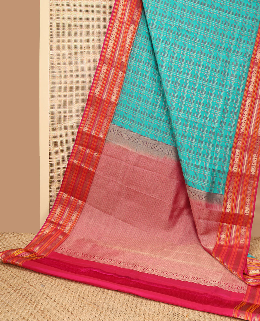 Green checked vasundhara elite silk saree with contrast traditional zari design border & intricate jaal design pallu