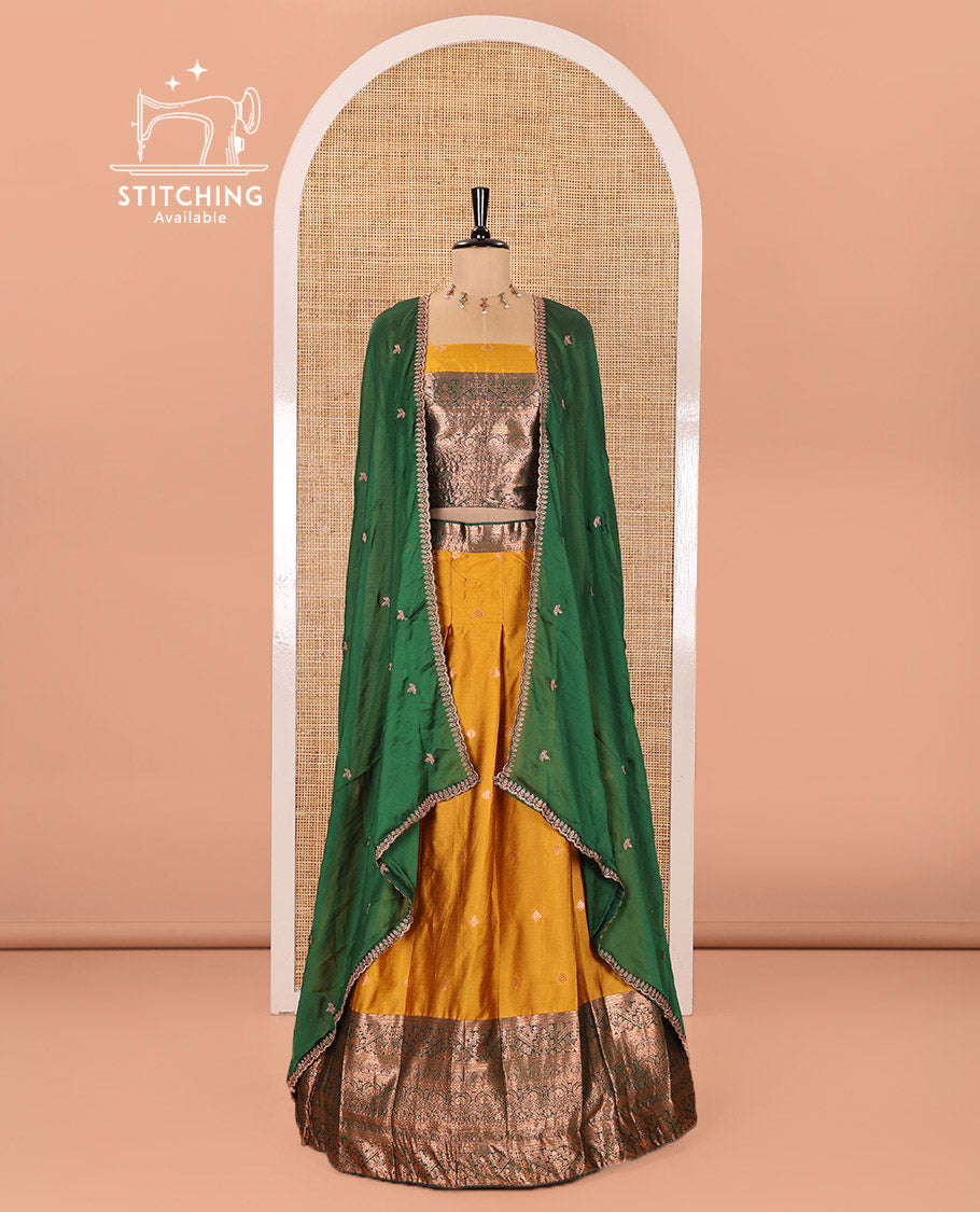 Yellow and Green Semi-Banarasi Half-Saree Adorned with Zari Buttas on Its Skirt, Complemented by a Contrast Mughal-Style Intricate Zari Design Border, Paired with a Matching Blouse, and a Satin Georgette Embroidered Scallop Dhavani