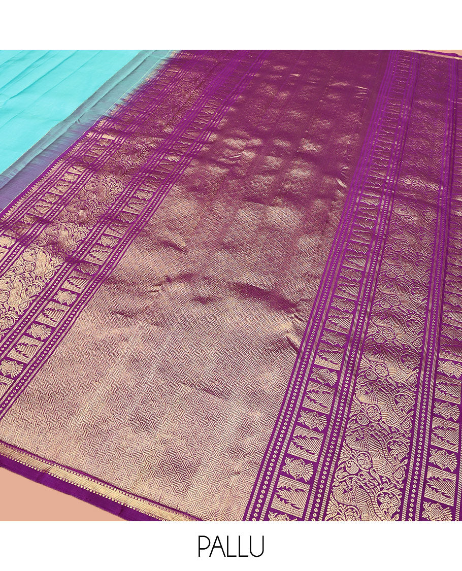 Blue Plain Kanchipuram Silk Saree, Subtle Zari Border of Muthu, Vanki, and Kili Designs, Captivating Contrast Pallu of Thilakam Mokku, Thazampoo Rekku, Iruthalai Pakshi, Kuthirai, and Jaal Designs, and Paired with a Contrast Blouse