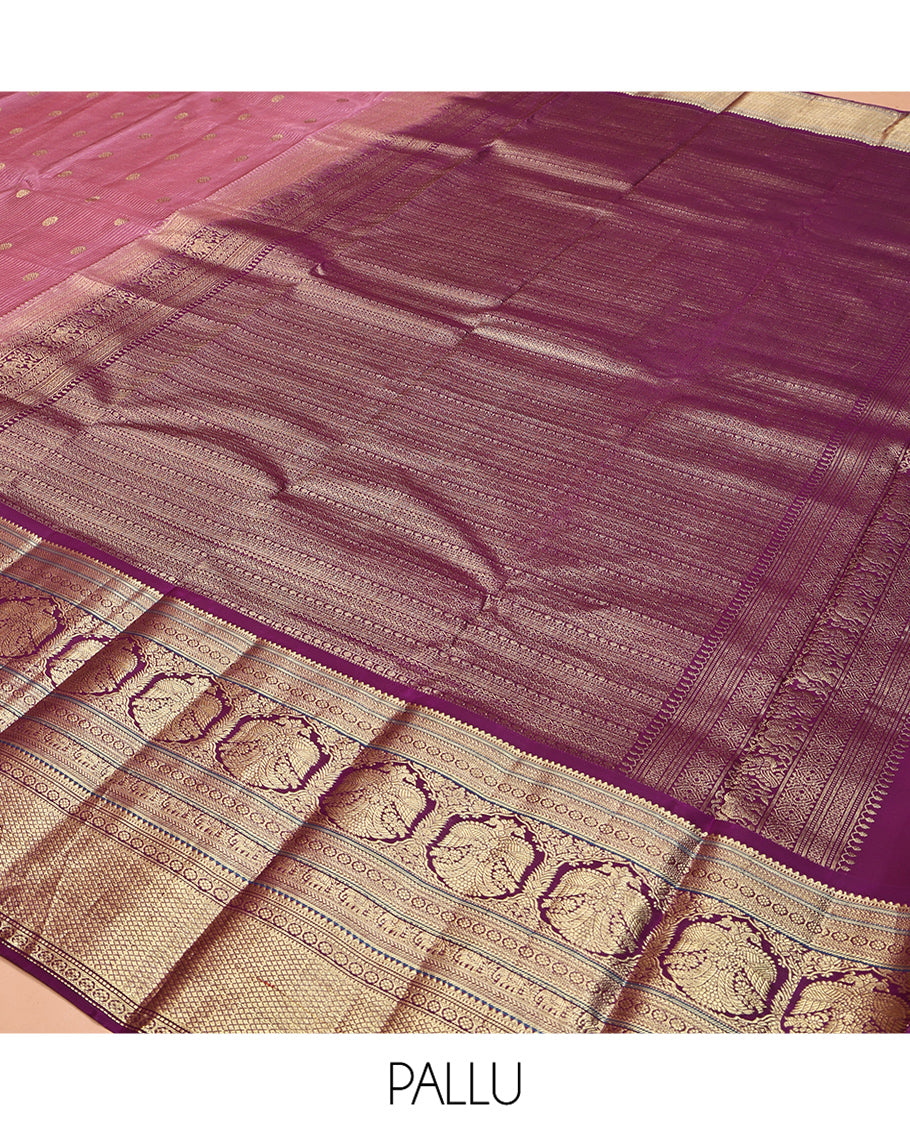 Pink Vasundhara Silk Saree, Elevated with Zari Stripes and Chakram Buttas All Over Its Body, Complemented by a Contrast Border of Rekku, Muthu, Kamalam and Mayil Kann Designs, Grand Geometric Patterned Pallu, and Paired with a Contrast Blouse
