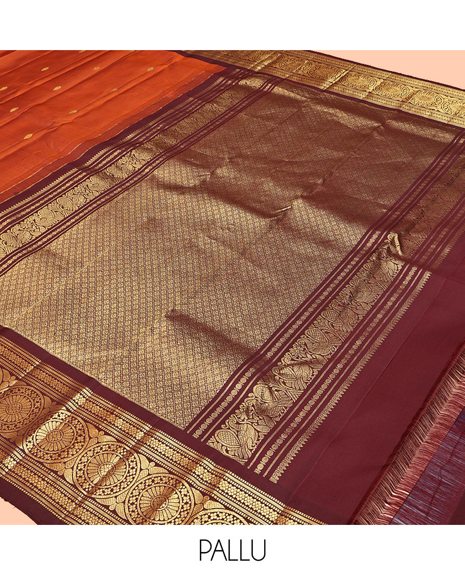 Orange Kanchipuram Silk Saree, Showcasing Zari Buttas All Over Its Body, Complemented by a Contrast Border of Muthu, Kathir, Kamalam, and Chakram Designs, Grand Jaal Pallu, and Paired with a Contrast Blouse