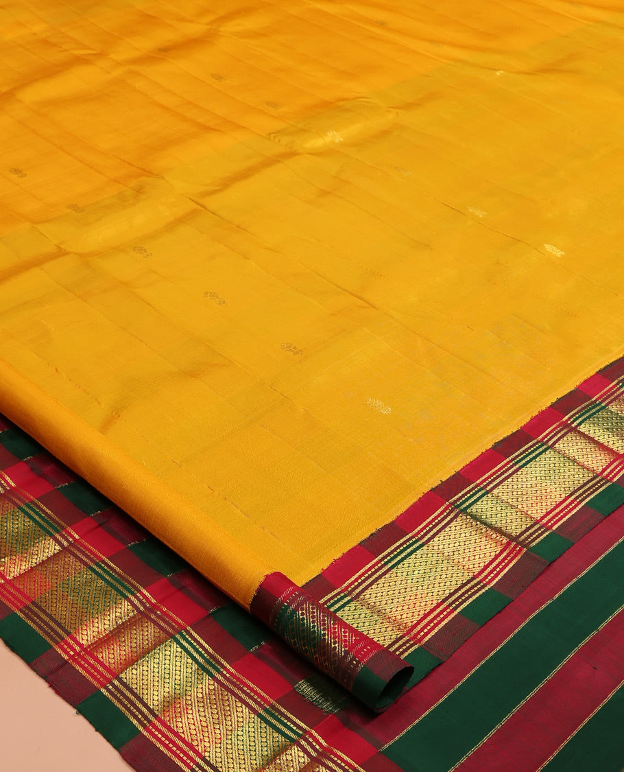 Yellow Kanchipuram Silk Saree, Woven with Zari Buttas, a Contrast One-sided Korvai Traditional Border, Pallu of Zari Designs, and No Blouse