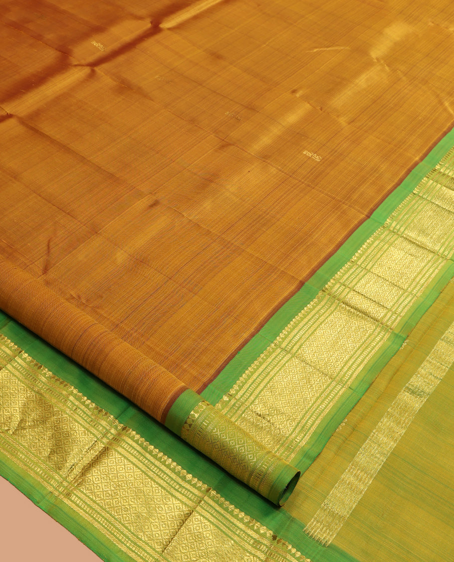 Mustard Kanchipuram Silk Saree, Elevated with Zari Buttas, a Contrast One-Sided Border of Rekku, Banaras, Muthu, and Mayil Design, Zari Design Pallu, and No Blouse
