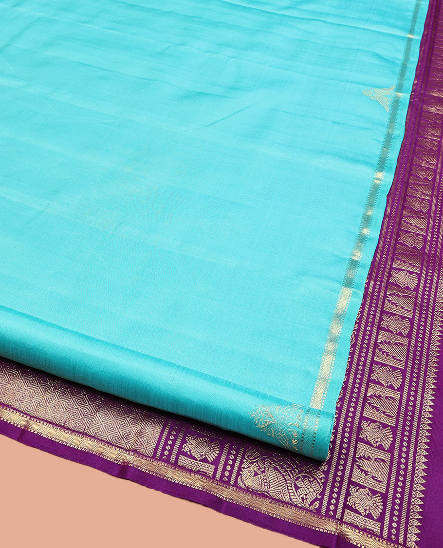 Blue Plain Kanchipuram Silk Saree, Subtle Zari Border of Muthu, Vanki, and Kili Designs, Captivating Contrast Pallu of Thilakam Mokku, Thazampoo Rekku, Iruthalai Pakshi, Kuthirai, and Jaal Designs, and Paired with a Contrast Blouse