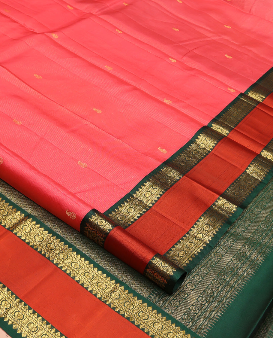 Pink Vasundhara Silk Saree, Subtly Woven with Stripes and Buttas All Over Its Body Complemented by Contrast Rettai Pettu Border of Thilakam, Banaras, Muthu, and Laddu Kamalam Designs, Grand Jaal Pallu and Paired with a Contrast Blouse