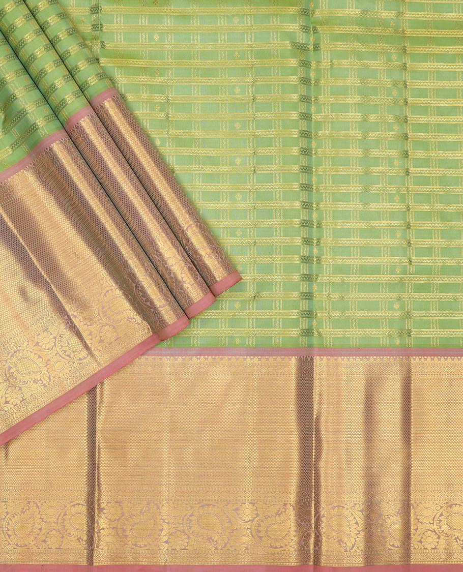 Green pure-silk half-saree, zari buttas and checked skirt, contrast kuyil kann and kodi manga border, zari design blouse, and a intricate zari woven dhavani