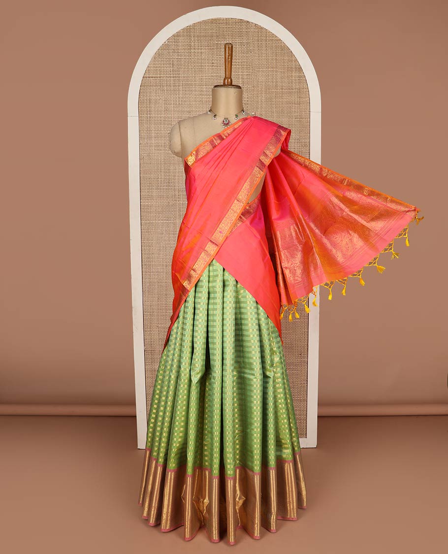 Green pure-silk half-saree, zari buttas and checked skirt, contrast kuyil kann and kodi manga border, zari design blouse, and a intricate zari woven dhavani