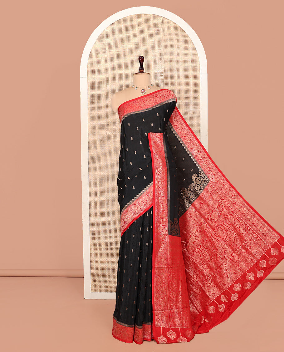 Black Fancy Crepe Saree, Spotlighted with Buttas, Complemented by a Contrast Floral Creeper Border, Intricately Designed Pallu, and a Contrast Blouse