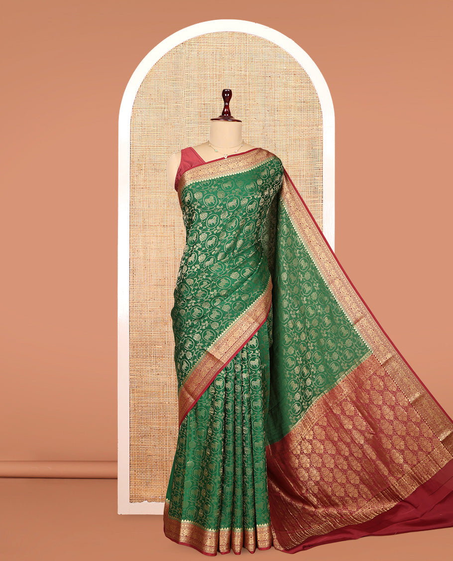 Green Mysore Silk Saree, Embellished with Lotus Vine and Pichwai Cow Designs, Complemented by a Contrast Traditional Zari Border, Grand Pallu, and a Contrast Blouse