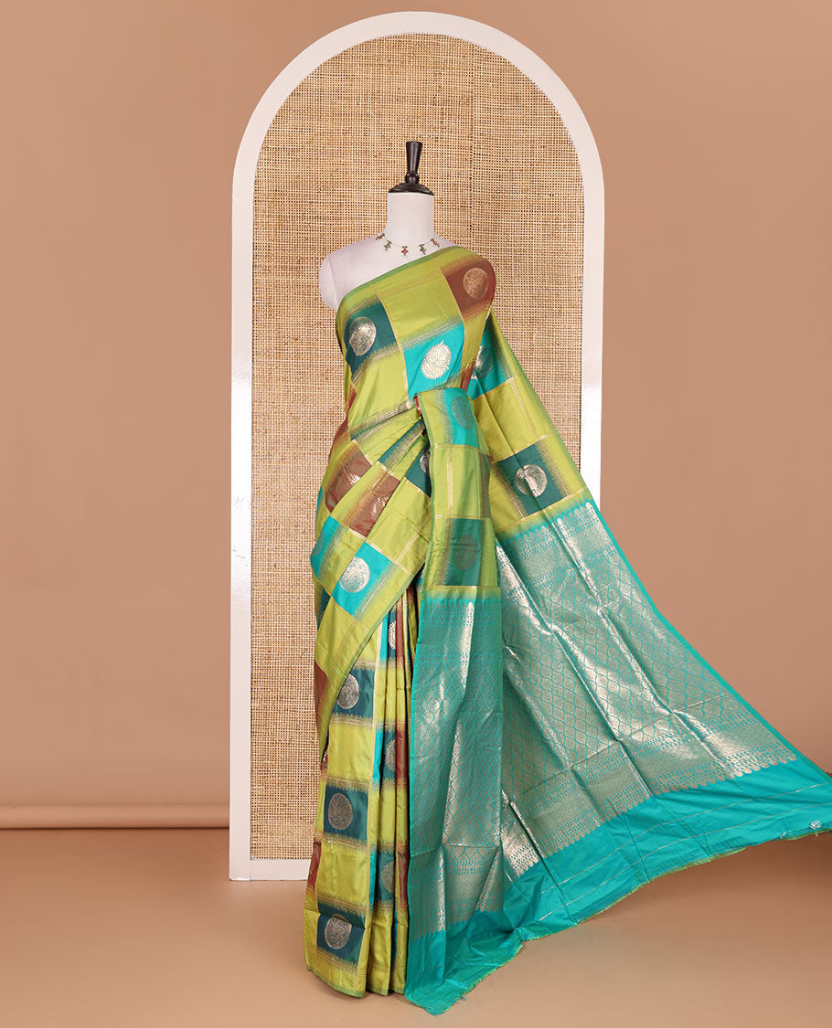 Borderless green chakra buttas enclosed, checked elite soft silk saree, contrast ogee patterned pallu, and contrast zari design blouse