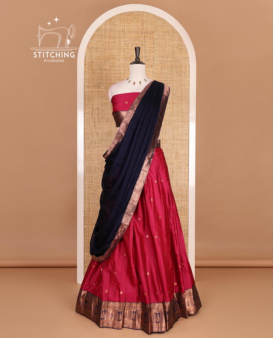 Pink taffeta silk half saree, zari buttas with contrast blue traditional zari border, matching zari blouse, and contrast plain zari border dhavani