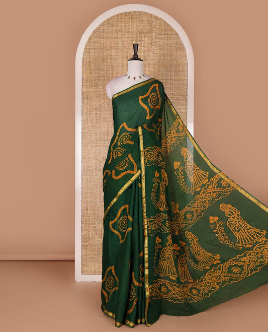 Green batik geometric printed pure cotton saree, zari piping border, human figurines batik printed pallu, and a matching batik printed blouse