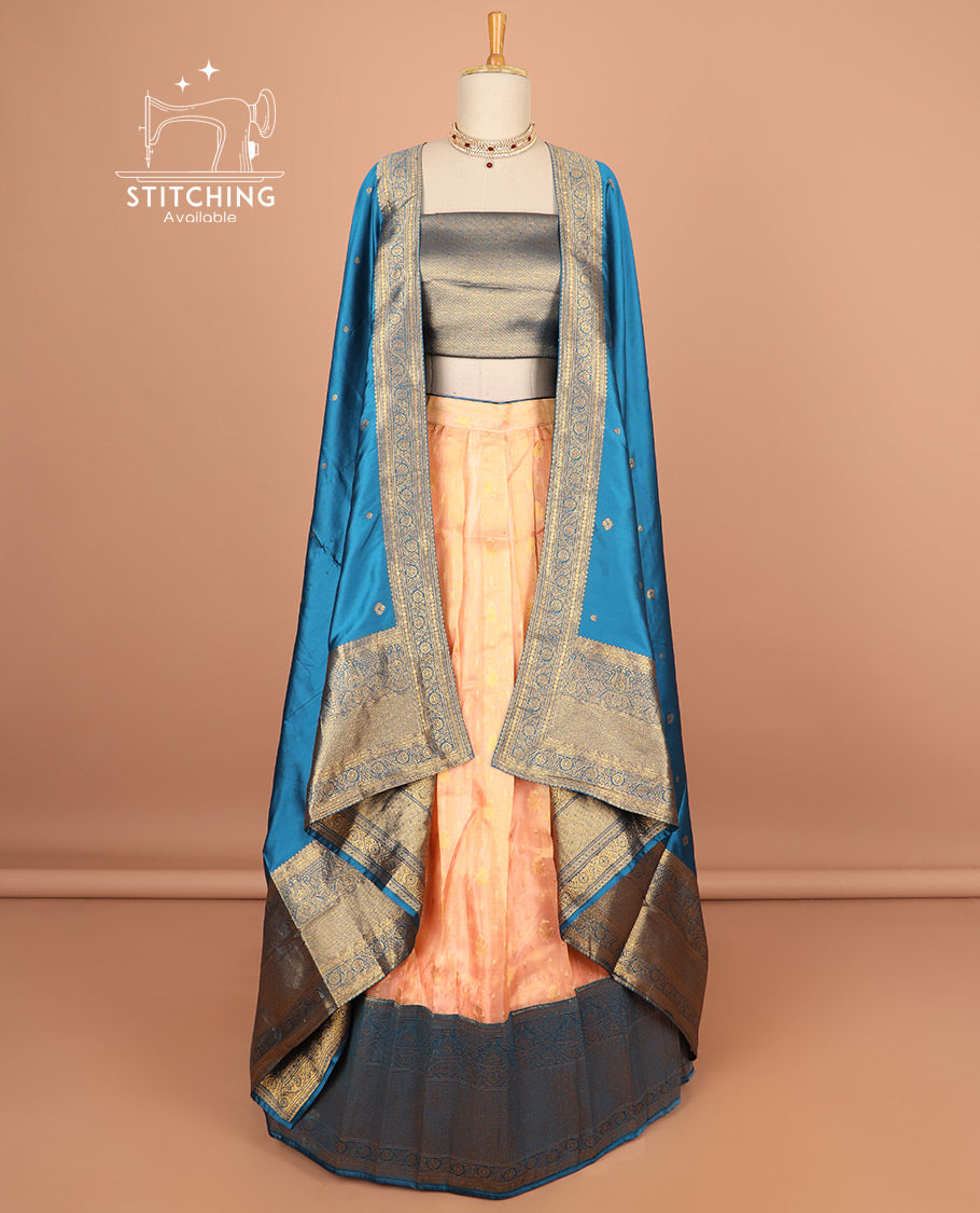 orange half saree with contrast zari design border, zari design blouse & floral zari design dhavani