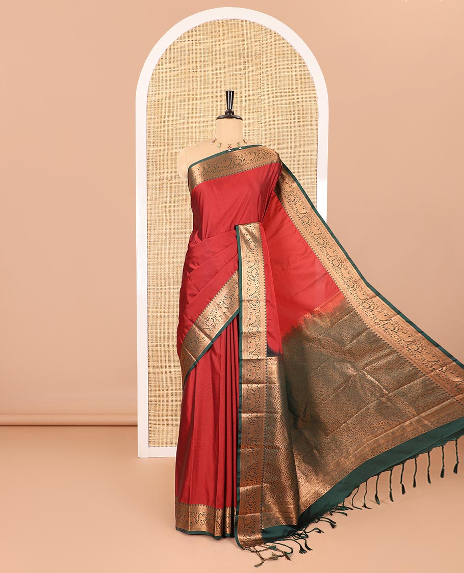 Maroon plain luxury soft silk saree, contrast traditional temple zari border of elephant motifs, geometric zari pallu, and a contrast jacquard blouse