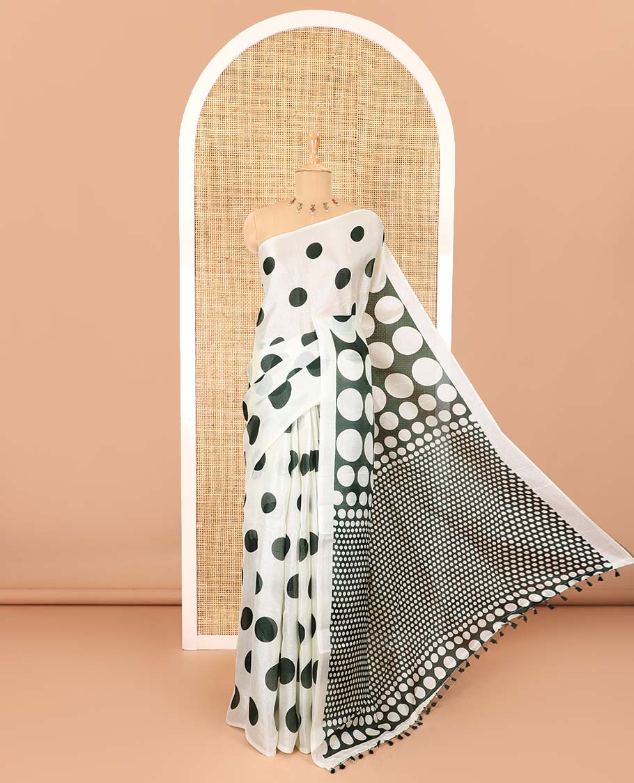 Borderless cream and green polka dots printed art khadi cotton saree, pallu steeped with polka dots, and a contrast tiny polka dots printed blouse