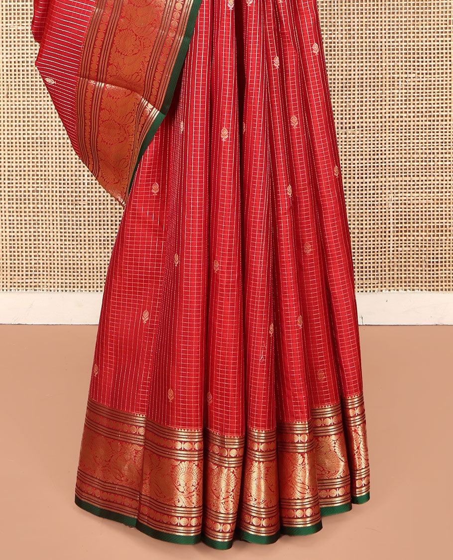 Red Kanchipuram Silk Saree, Richly Detailed with Zari Butta Enclosed Checks on Its Body, Highlighted by Zari Border of Rekku, Poun, Banaras, and Mayil Kann Designs, Diagonally Striped Pallu, and Paired with a Contrast Blouse