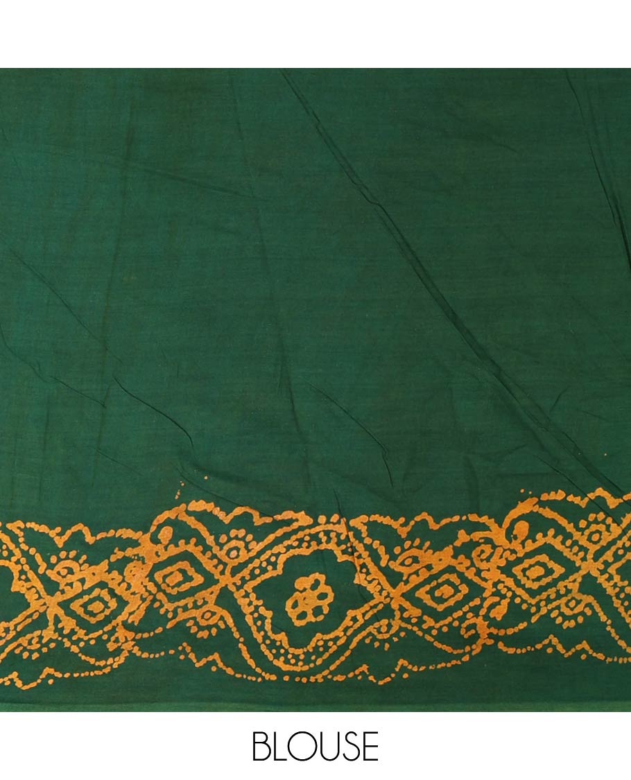 Green batik geometric printed pure cotton saree, zari piping border, human figurines batik printed pallu, and a matching batik printed blouse