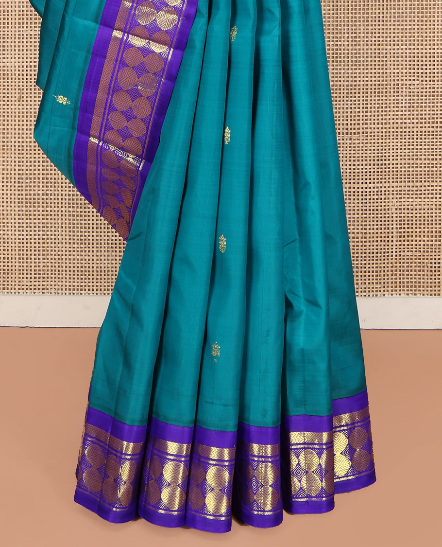 Blue Kanchipuram Silk Saree, Bedecked with Zari Buttas on Its Body, Complemented by a Contrast One-Sided Border of Vanki, Banaras, and Poun Designs, Pallu of Zari Designs, and Comes Without a Blouse
