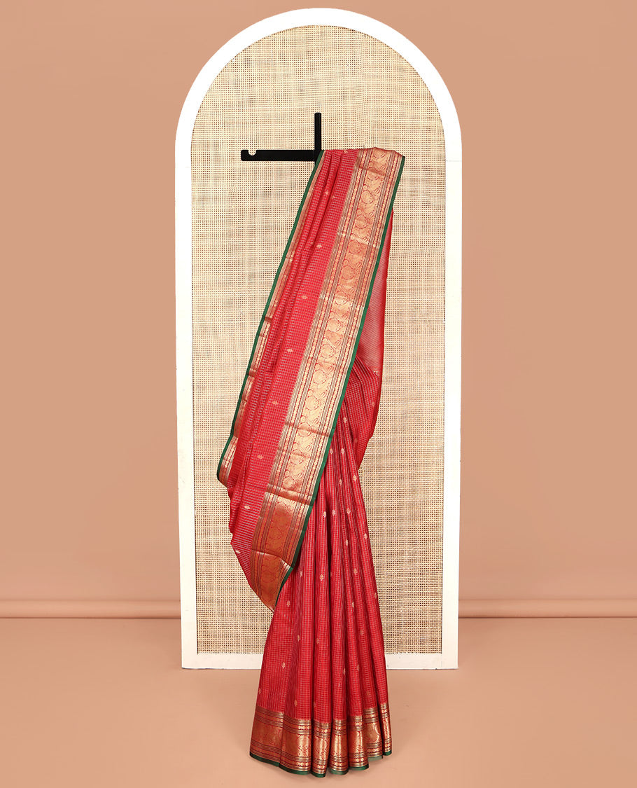 Red Kanchipuram Silk Saree, Richly Detailed with Zari Butta Enclosed Checks on Its Body, Highlighted by Zari Border of Rekku, Poun, Banaras, and Mayil Kann Designs, Diagonally Striped Pallu, and Paired with a Contrast Blouse
