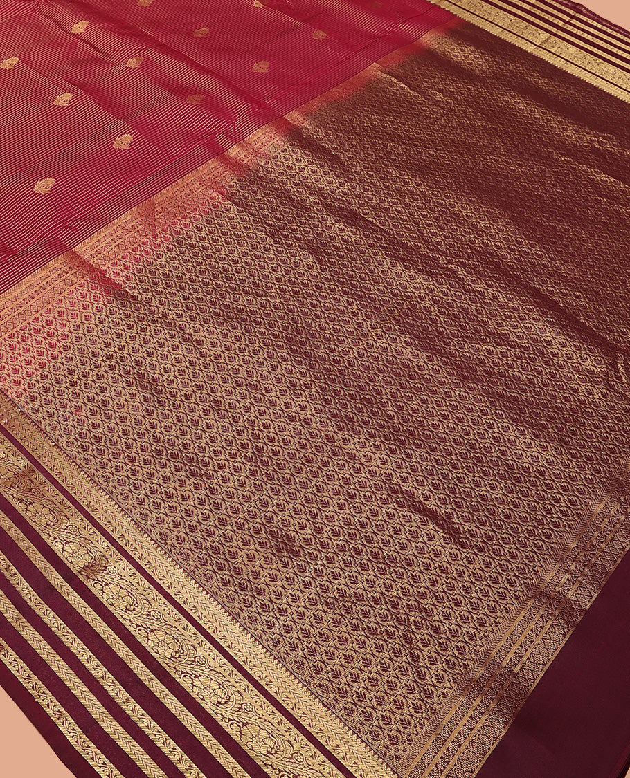 Apple red zari buttas and striped Vasundhara silk mix saree, contrast border of thilakam mokku, banaras, kathir, and kodi visiry designs, and jaal pallu