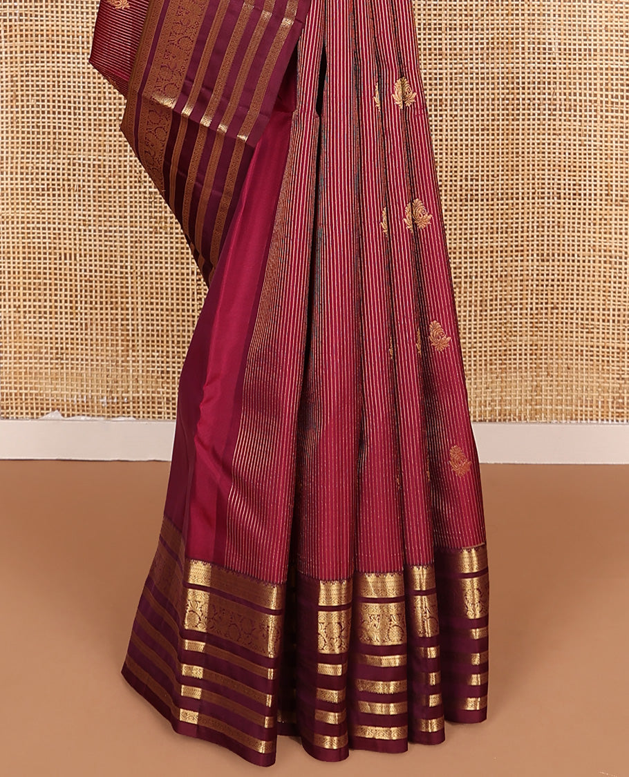 Apple red zari buttas and striped Vasundhara silk mix saree, contrast border of thilakam mokku, banaras, kathir, and kodi visiry designs, and jaal pallu