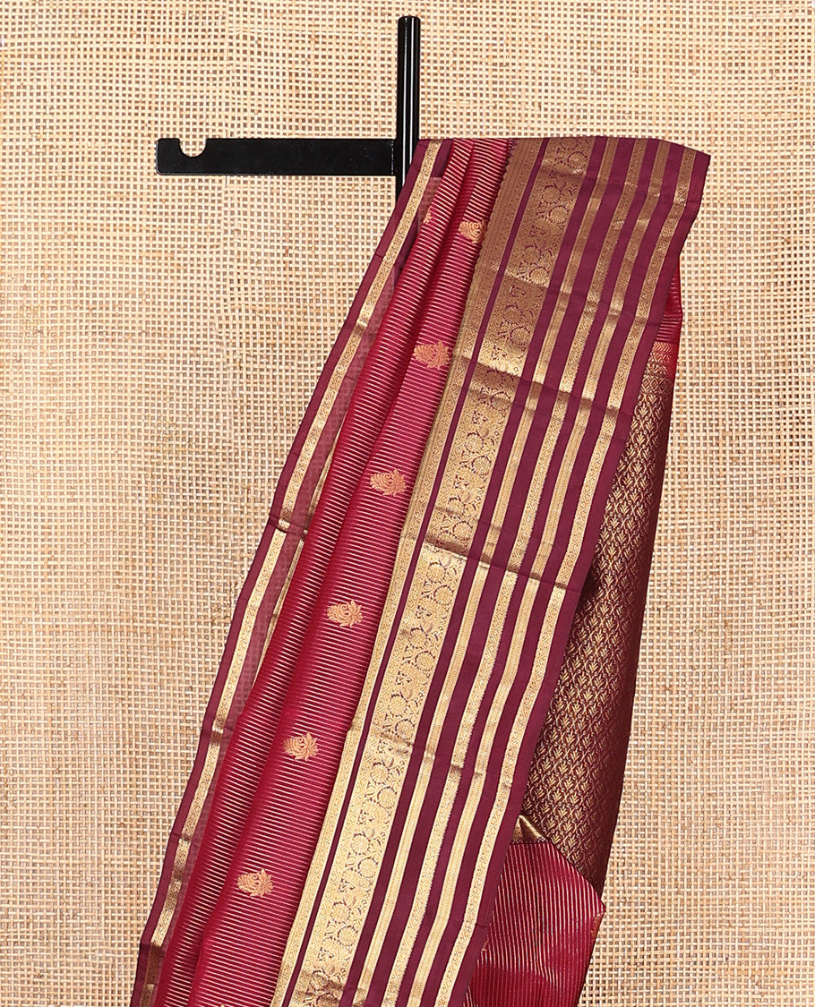 Apple red zari buttas and striped Vasundhara silk mix saree, contrast border of thilakam mokku, banaras, kathir, and kodi visiry designs, and jaal pallu