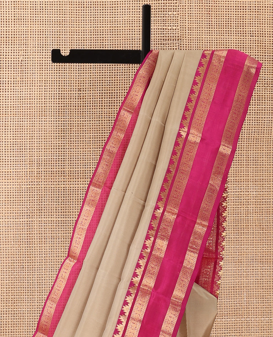 Sandal plain Kanchipuram silk saree, contrast rettai pettu border of thazampoo rekku, neli, chakram, and kuthirai, and jaal pallu