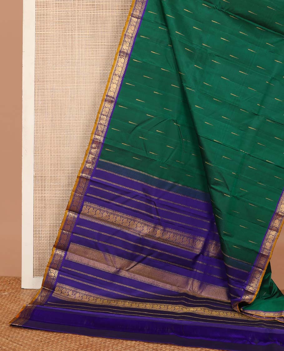 Green malli mokku buttas Kanchipuram silk saree, contrast border of rekku, muthu, banaras, and mayil designs, and traditional design pallu