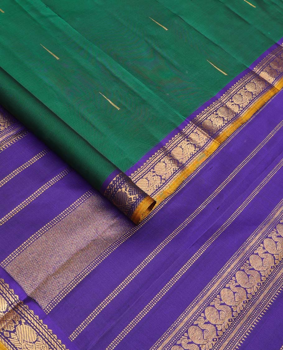 Green malli mokku buttas Kanchipuram silk saree, contrast border of rekku, muthu, banaras, and mayil designs, and traditional design pallu