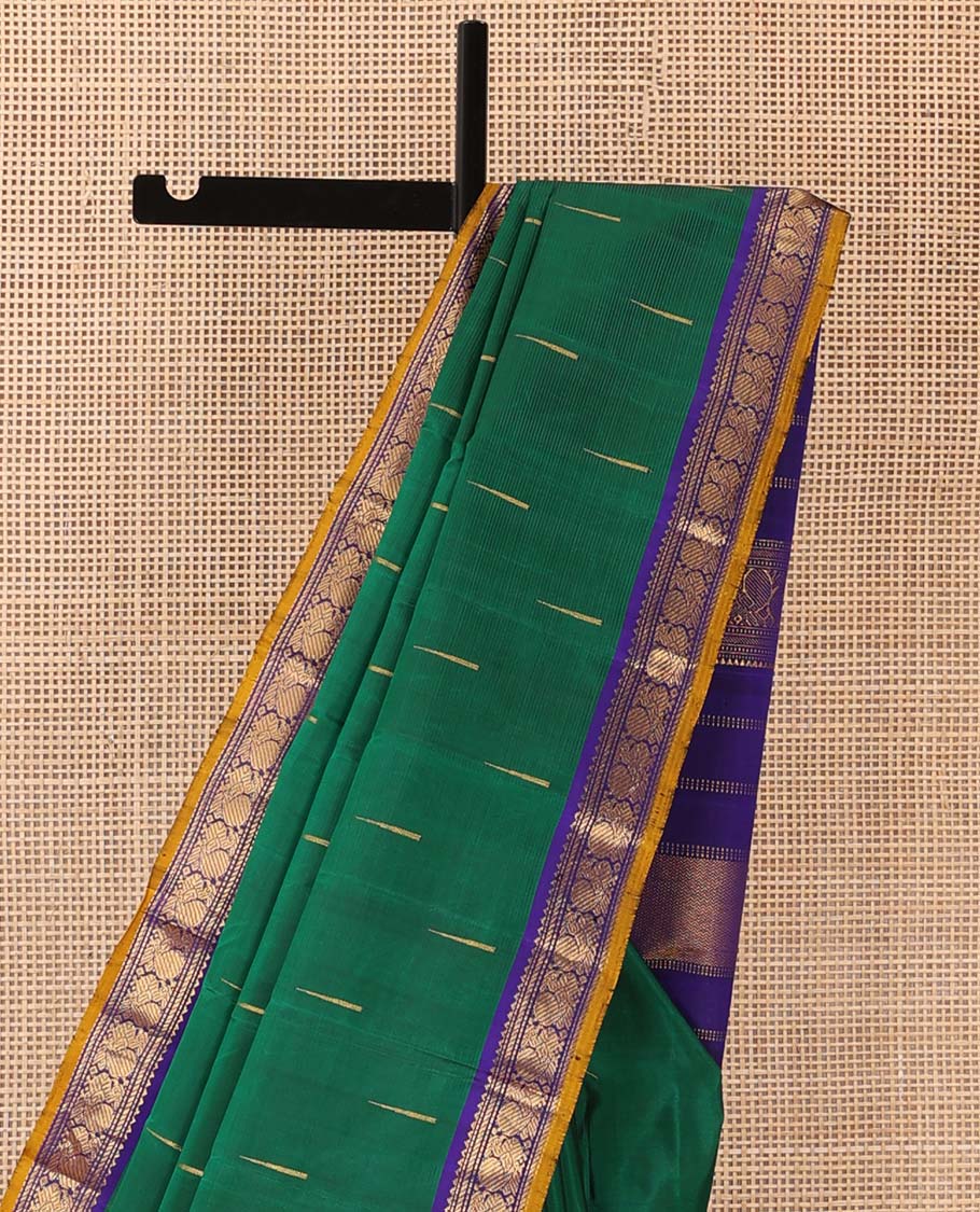 Green malli mokku buttas Kanchipuram silk saree, contrast border of rekku, muthu, banaras, and mayil designs, and traditional design pallu