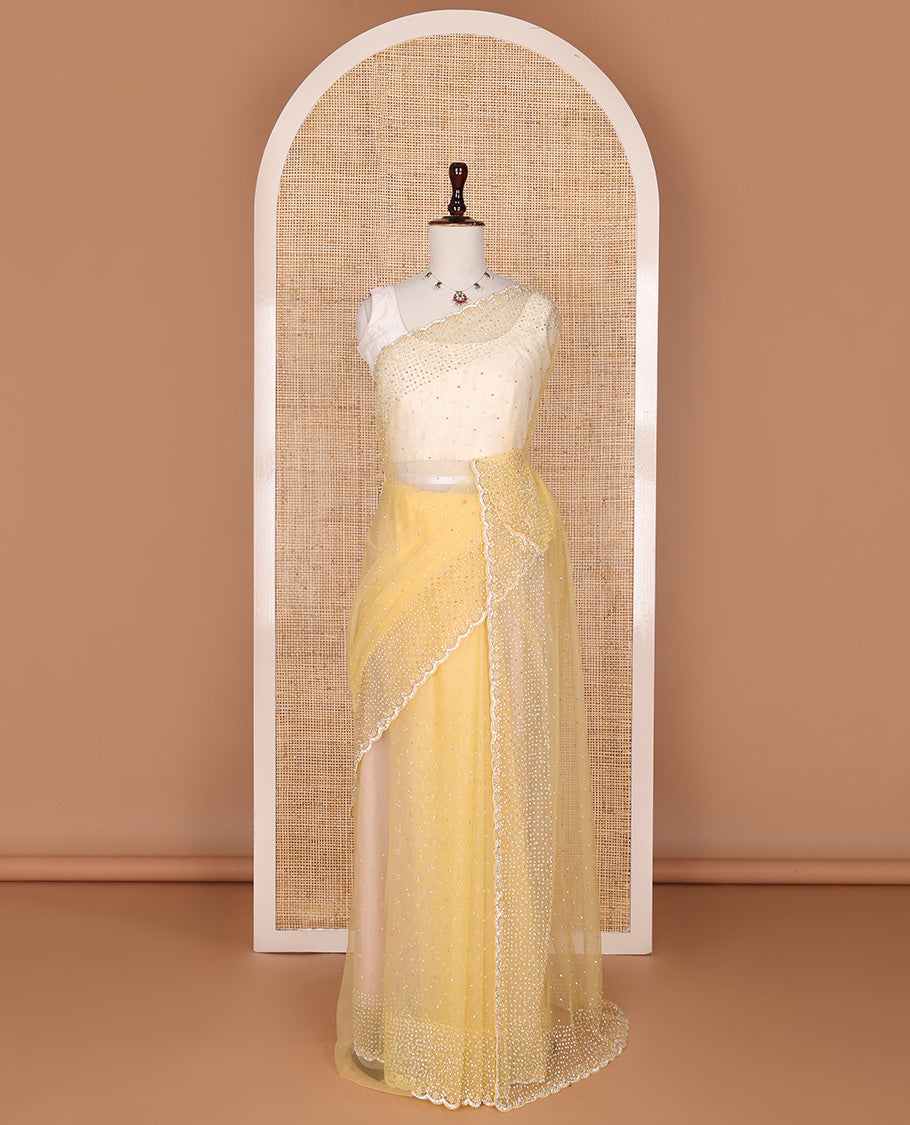 Pale yellow crystal stone & pearl beads embroidered designer saree with scallop embroidered border
